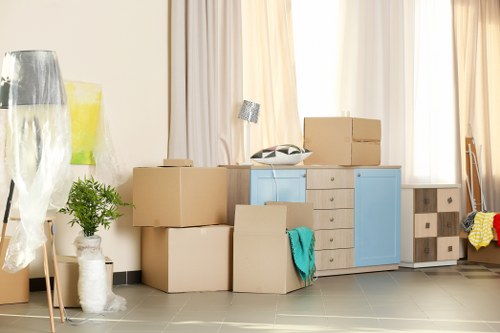 Removal team planning a move in a Canary Wharf apartment building