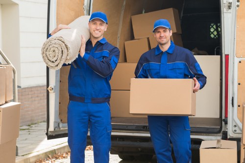 Van removals team sorting reusable and recyclable items in Canary Wharf