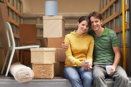 Local movers handling desks and office items during a Canary Wharf relocation